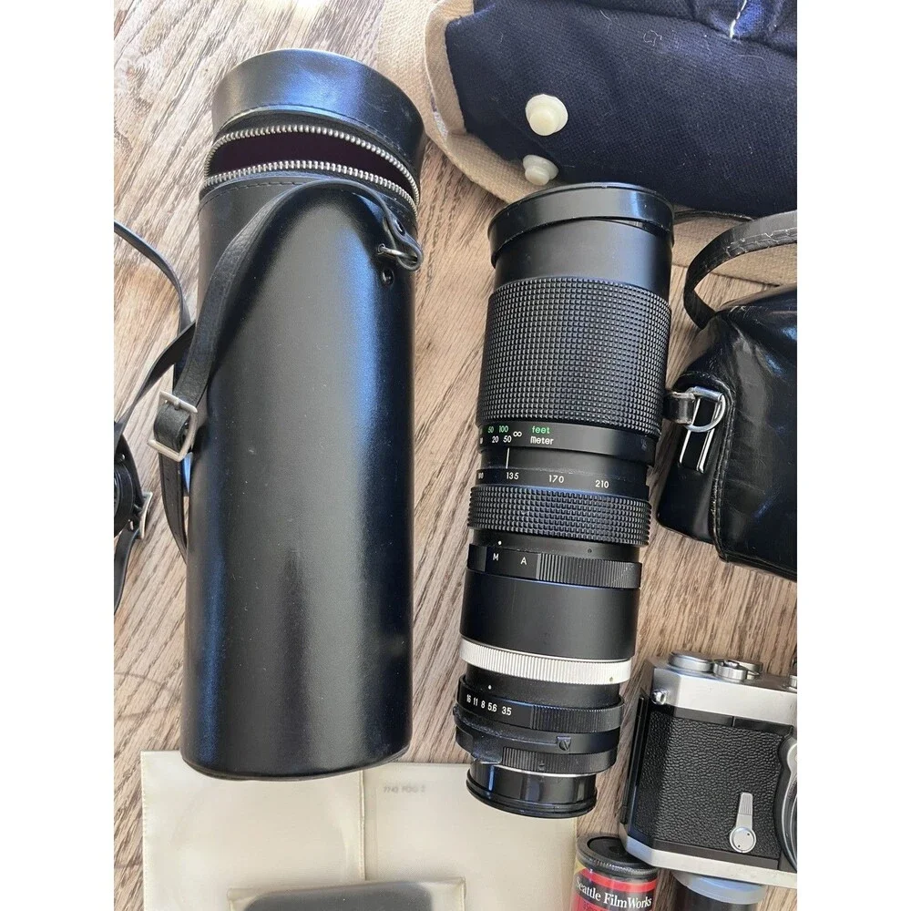 Nikon Nikkormat FTN 35 mm Camera with Additional lens, leather cases, & extras